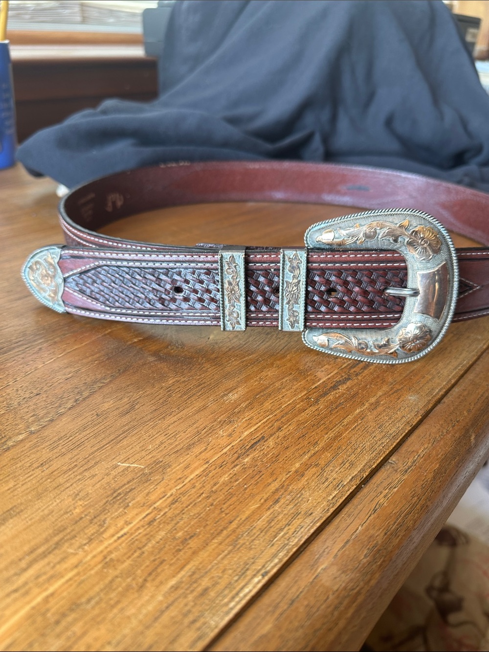 Vintage western type belt buckle. Sterling and 10 kt gold. Nice belt, size 38.